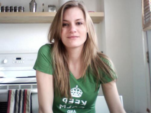 Pretty blonde with perky juicy boobs poses in green KCCO top