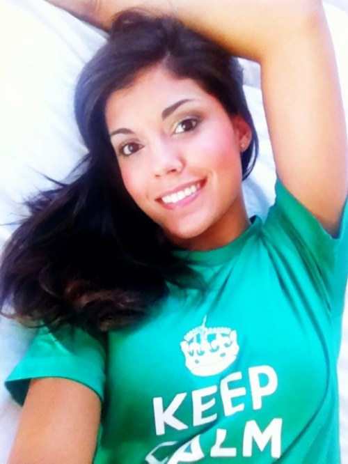 Pretty brunette with perky juicy boobs takes selfie in green KCCO top