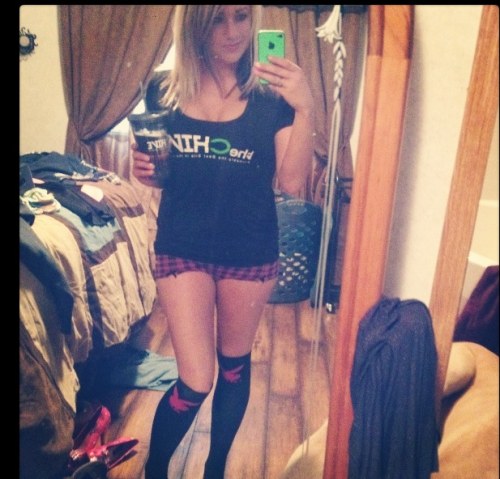 Blonde with slender legs and hot sexy body takes selfie in red/black checked shorts and theChive tee