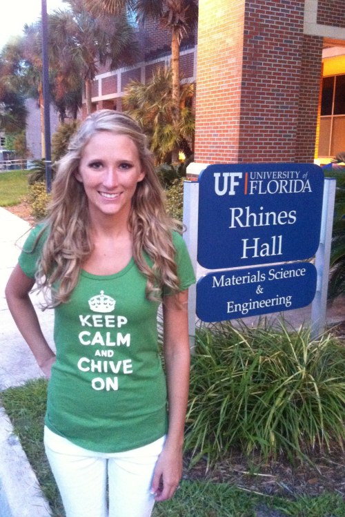 Blonde with perky boobs poses in green KCCO top and white pants