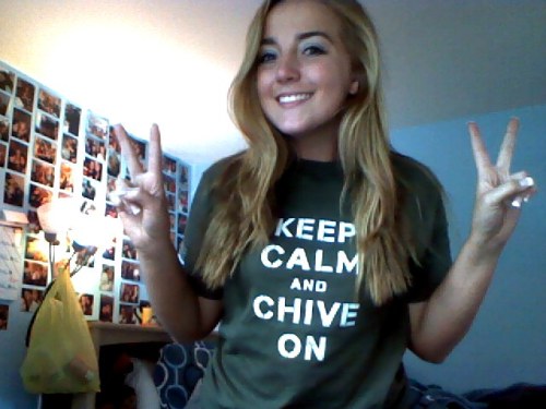 Pretty blonde poses in green KCCO tee