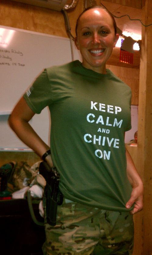 Military brunette with perky boobs and slim sexy body poses in green KCCO tee and camouflage pants