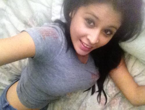 Brunette with perky juicy big boobs and slim sexy body takes selfie on bed in gray top