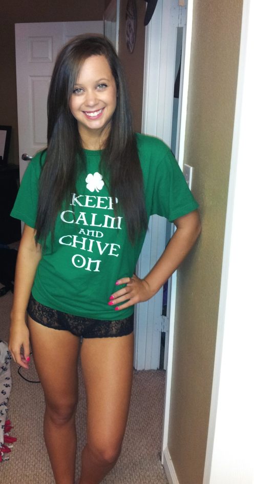 Pretty brunette with sexy legs and supple hot tanned body poses in green KCCO tee and black lace panties
