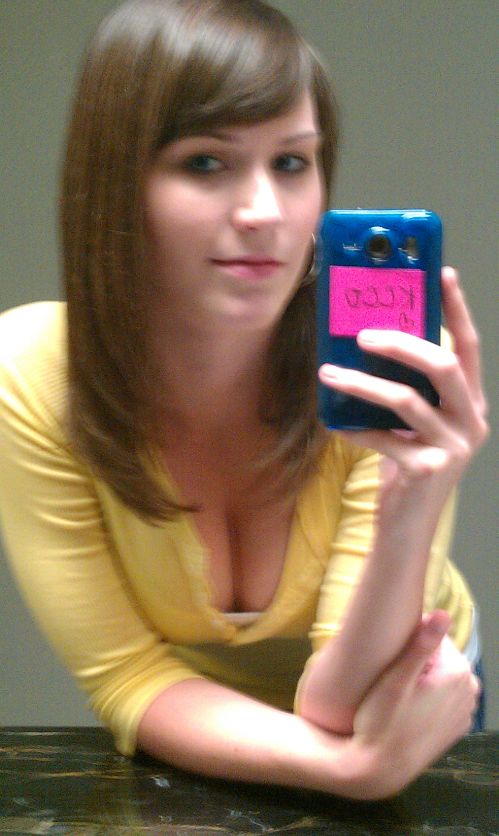 SWEET girl shows her flawless skin and pink lips while taking selfie in yellow top