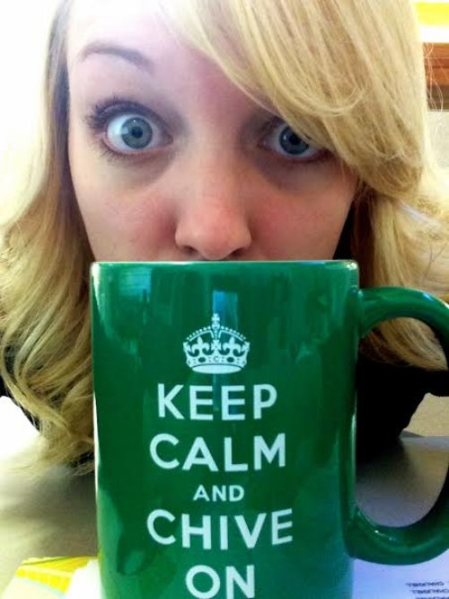 Blonde with grey eyes takes selfie with green KCCO cup
