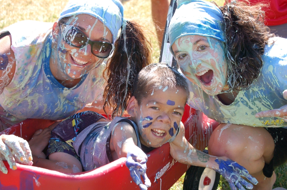 ChiveCharities The Painted Turtle girls covered in paint pose with Josh Burger