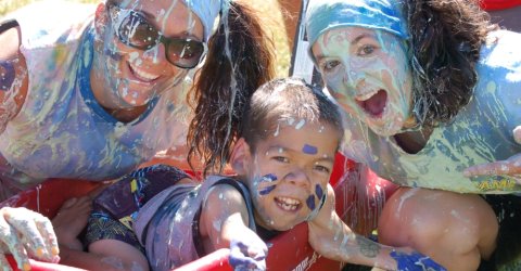 ChiveCharities The Painted Turtle girls covered in paint pose with Josh Burger