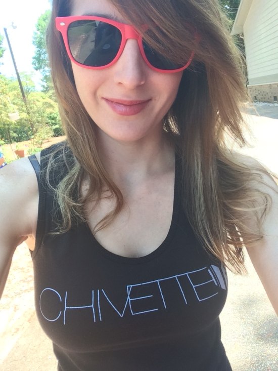 Girl in chivette tank top and pink sunglasses