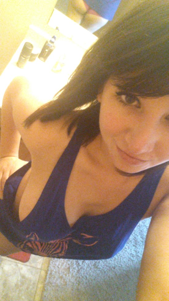 girl in blue tank top with no bra on