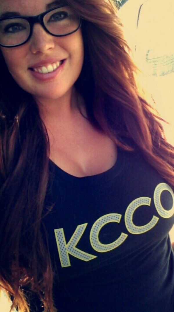 Happy teen girl taking her selfie wearing KCCO printed top