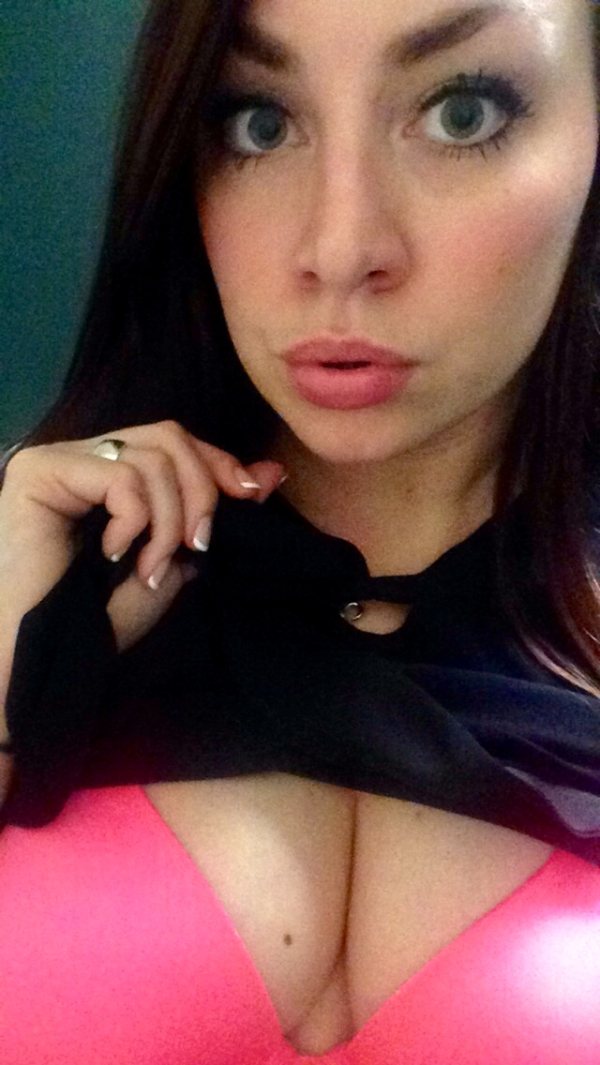 Big eyed babe takes off her top to show her perky cleavage