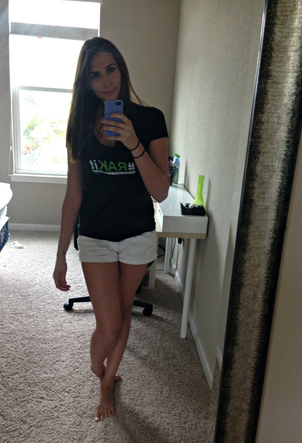 Slim babe takes her mirror selfie,wearing black top and white shorts