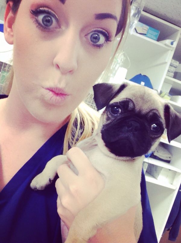 Girl with pug puppy