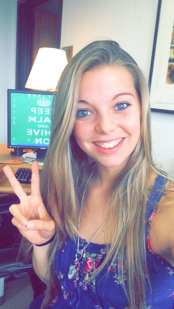 Girl with peace hand sign and KCCO Background