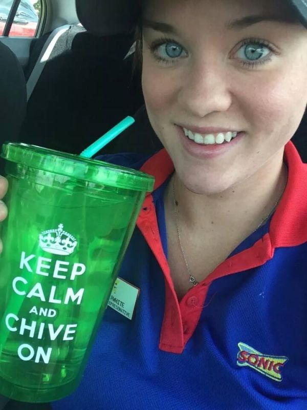 Girl in sonic uniform with keep calm and chive on cup