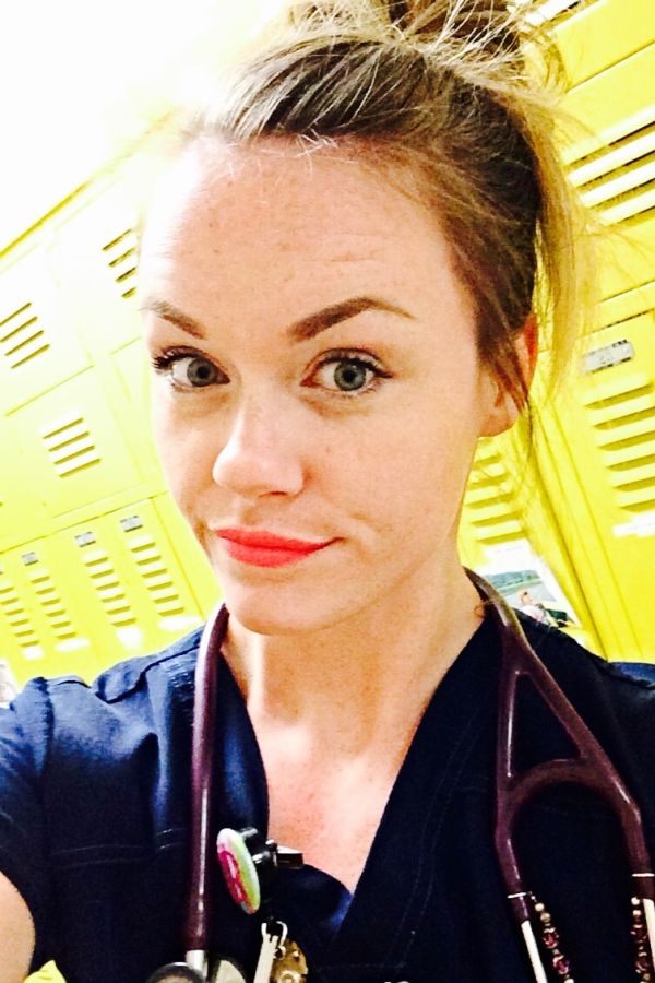 Girl with stethoscope in scrubs