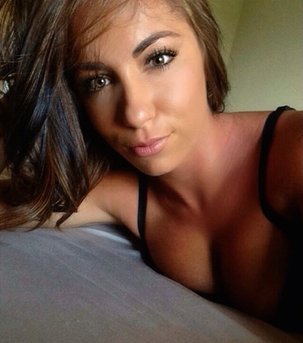 Girl in bed with black bra