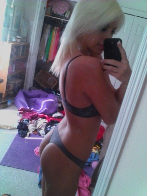 Blonde girl in black thong and bra