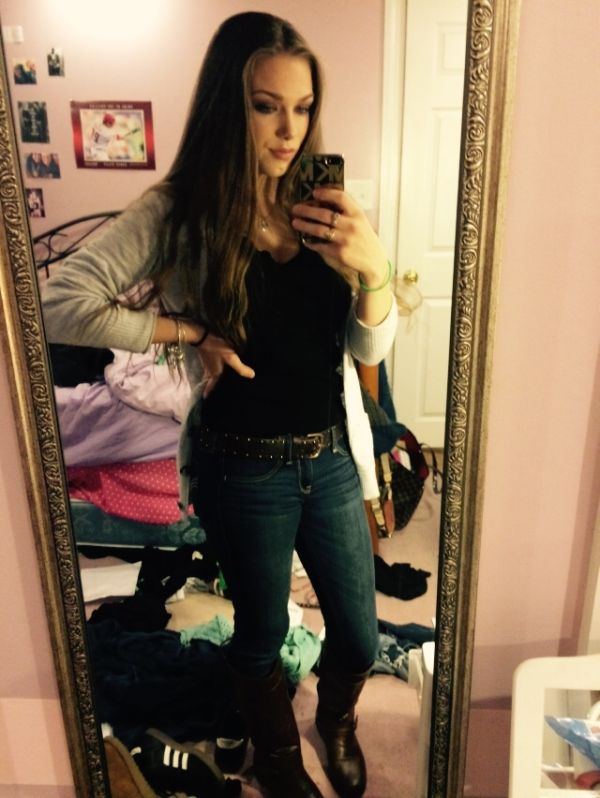 Girl in black shirt and jeans