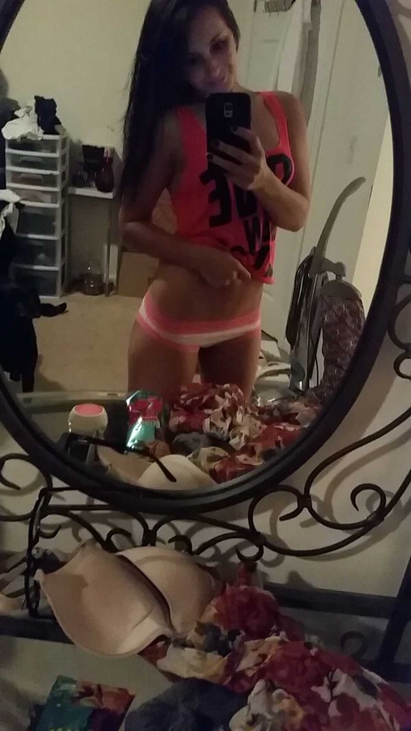 Girl in pink and whit panties in mirror
