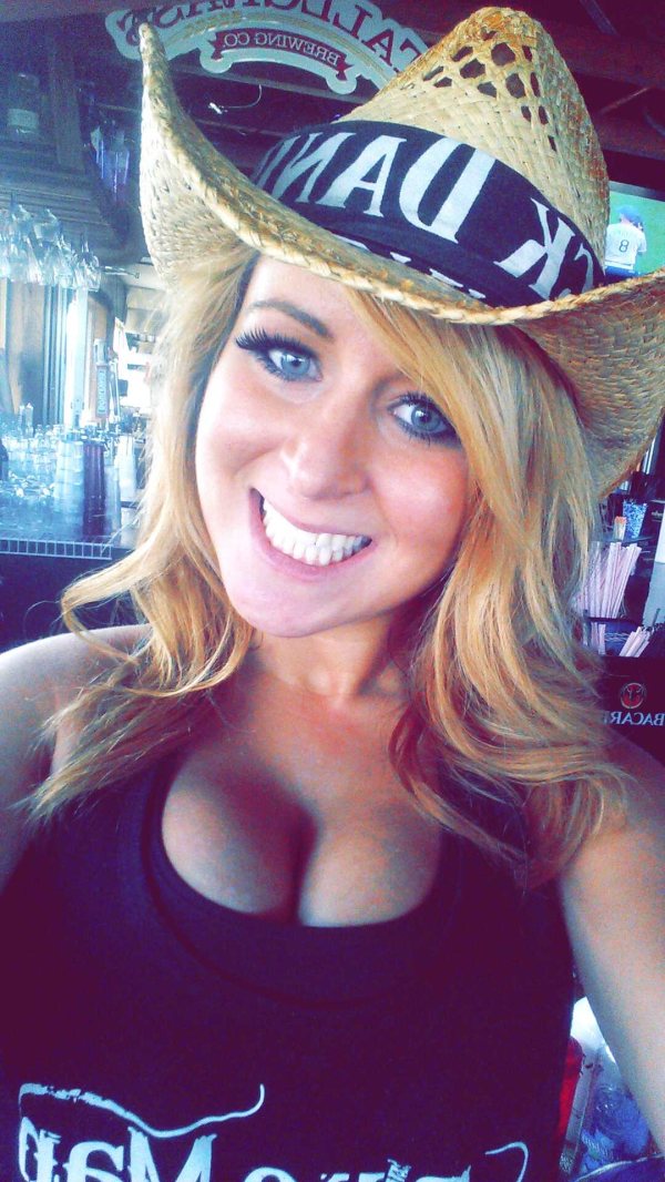 Girl in jack daniels cowboy hat with cleavage