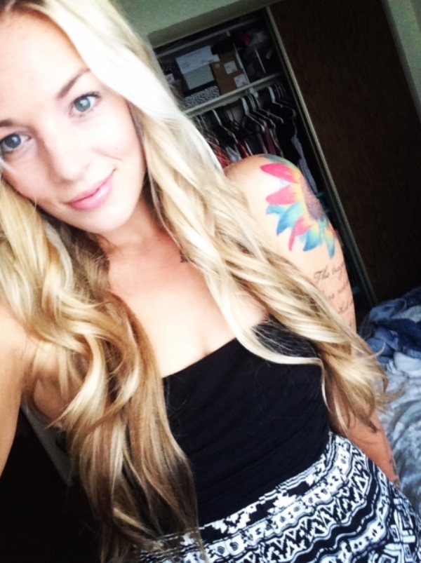 Blonde selfie girl with tattoo sleeve