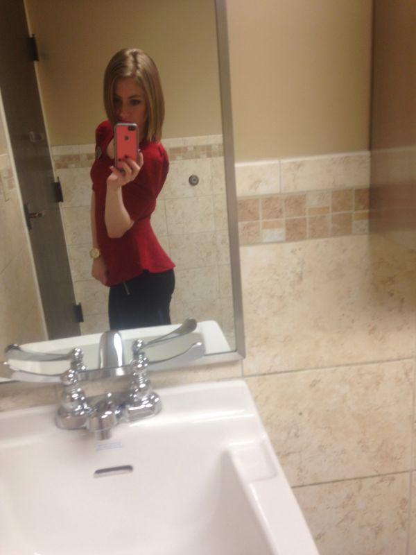 Pretty blonde with perky boobs and booty and slim sexy hot body takes selfie in red top and black pants