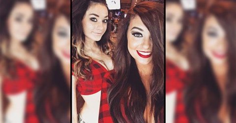 Pretty light-eyed brunettes with juicy lips, supple big bouncy boobs and slim sexy curvy hot body pose for selfie in red/black cleavage showing knotted shirt