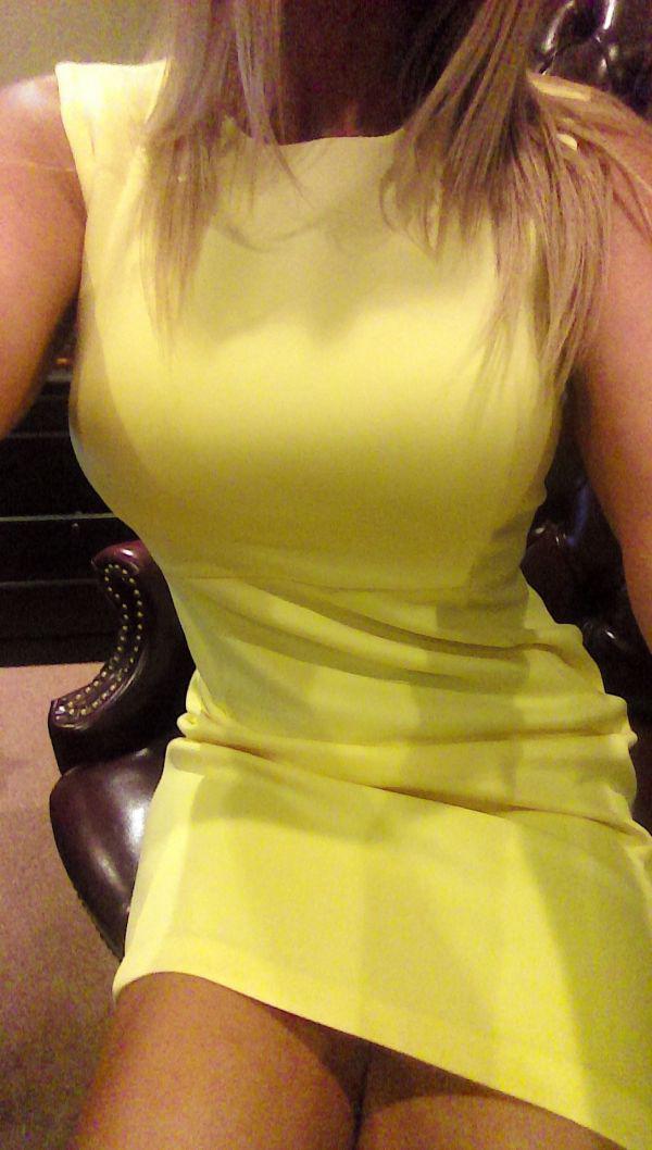 size zero babe in yellow one piece party dress shows her super sexy waist while taking busty boobs selfie