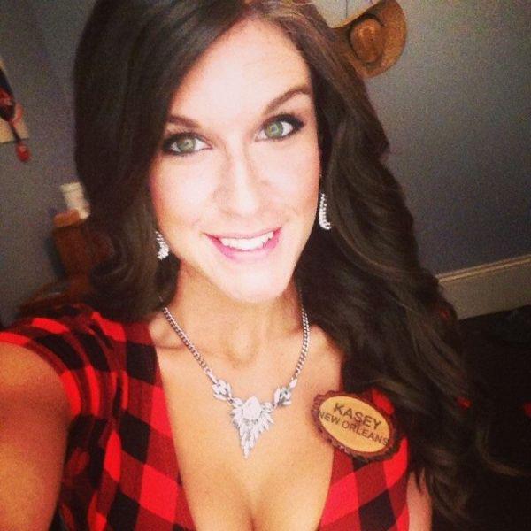gorgeous green eyed woman in red check KASEY NEW ORLEANS office dress clicks sexy cleavage selfie