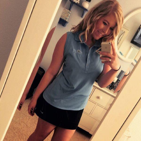 beautiful babe in gray color top and black short skirt from nike, takes mirror selfie