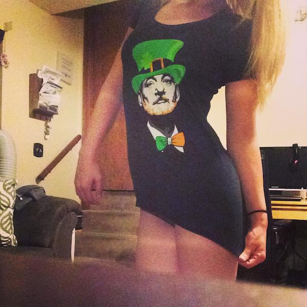 sexy blonde pulls down her BILL MURRAY face print black top to covers her nice round butt