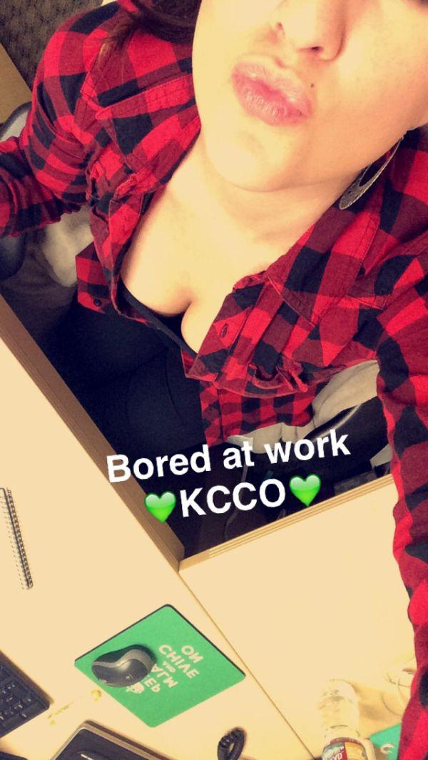 sexy office chick in red black check shirt clicks sexy boobs selfie in office with caption - Boared at work KCCO