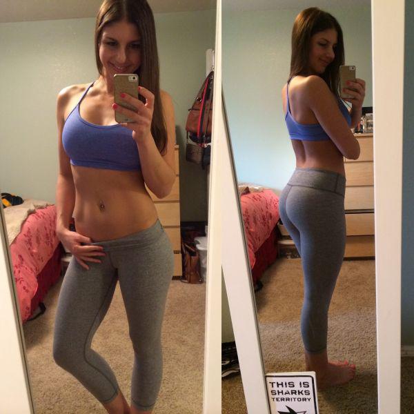Girl with sexy ass takes a selfie in gray track pants.