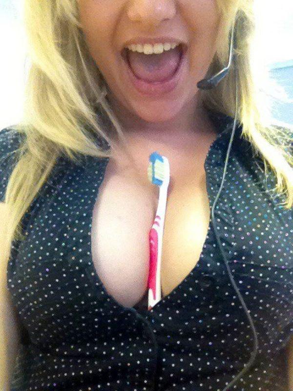 naughty babe clicks sexy selfie with toothbrush between big round boobs while wearing black white polka dots front open top