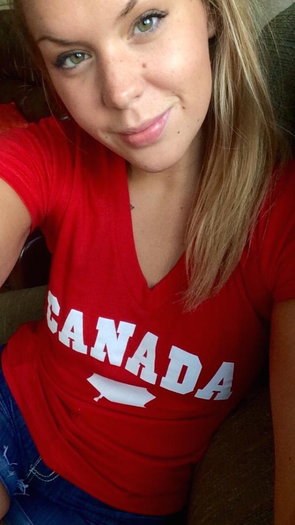 Brown eyed babe takes her selfie wearing red CANADA printed top