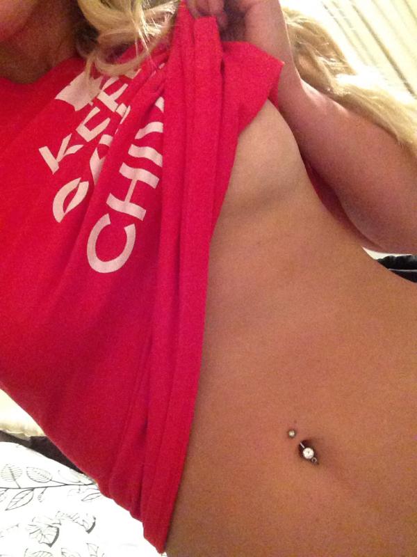 Hot babe takes off her KEEP CALM AND CHIVE ON printed top.showing her belly ring