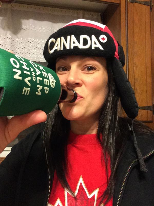 Naughty woman having KEEP CALM AND CHIVE ON beer,wearing CANADA printed black cap