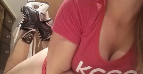 Hot woman shows off her cleavage wearing red KCCO printed top and heel shoes