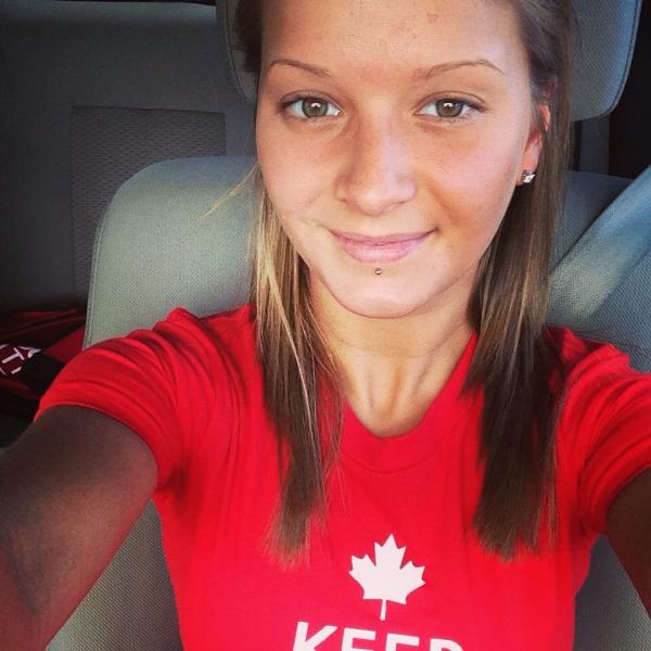 Slim baba clicking her selfie wearing red KEEP CALM printed top in a car