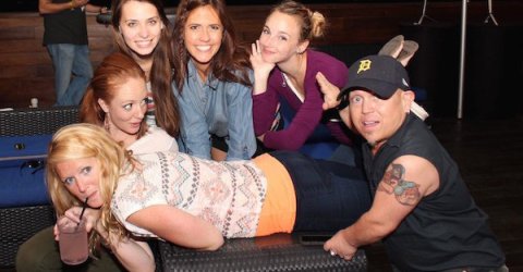 hot girls hanging out with a midget in a detroit baseball cap drinking alcohol