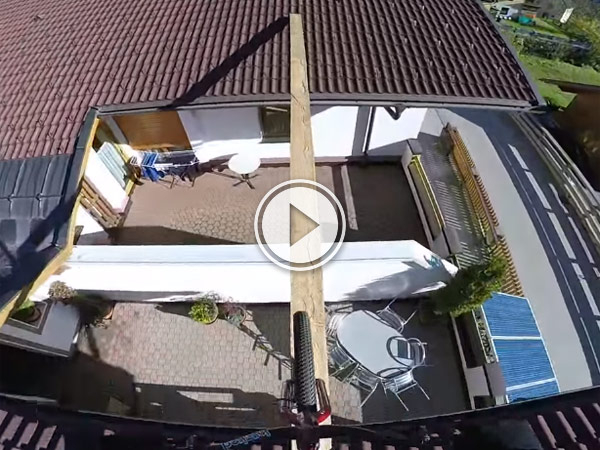 Video of a guy on a bike cycling down hill away from the police in a crazy stunt.