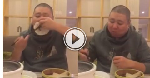 This guy has got the best way to eat Peking Duck ever.