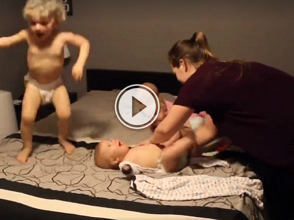 Just changing four kids at once, no big deal (Video)