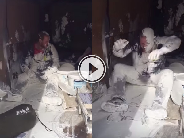 Painter and decorator has a very bad day at the office and paint is everywhere.