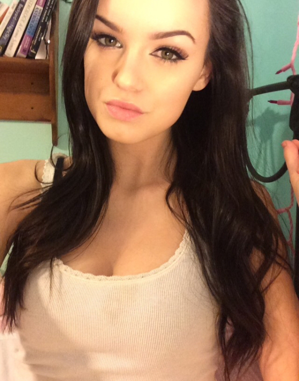 Beautiful teen girl with sexy hazel eyes looking hot in white tank top