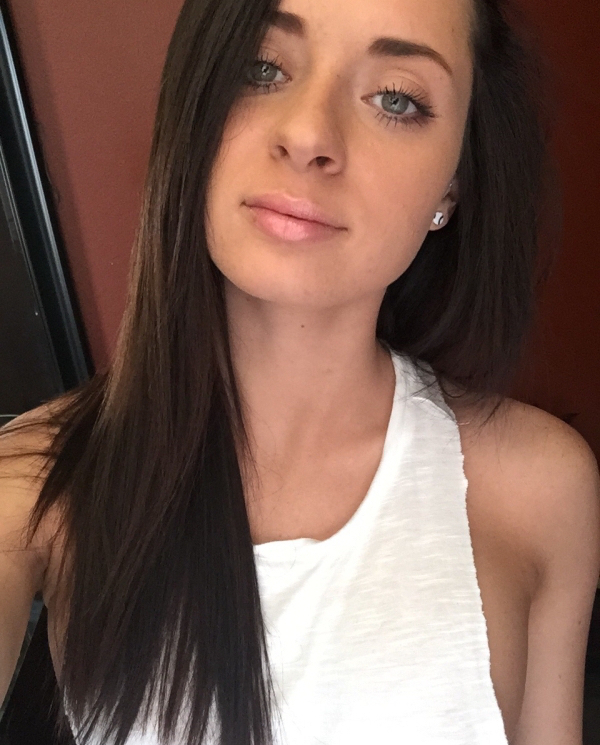 Beautiful hazel eyed babe clicks a natural look selfie without make-up