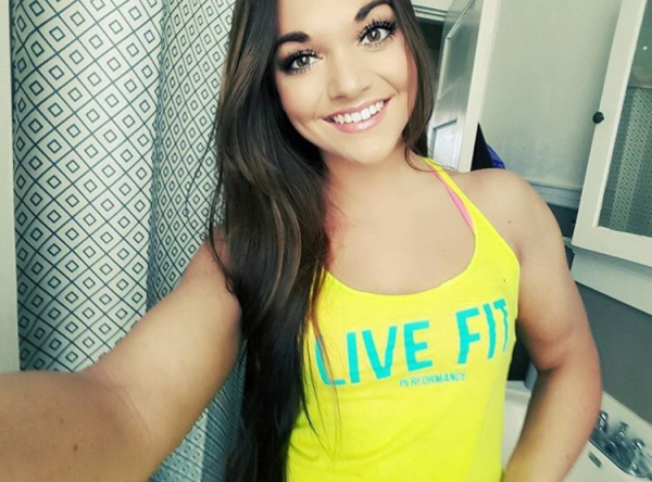 Pretty chick in hot yellow halter top smiling cutely