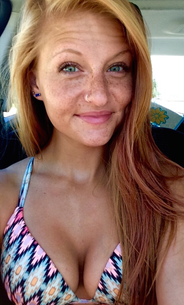 Hot blonde with freckles on her face and sexy bikini top